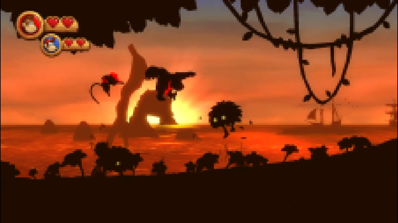 Donkey and Diddy Kong silhouetted against a sunset during active Country Returns platforming