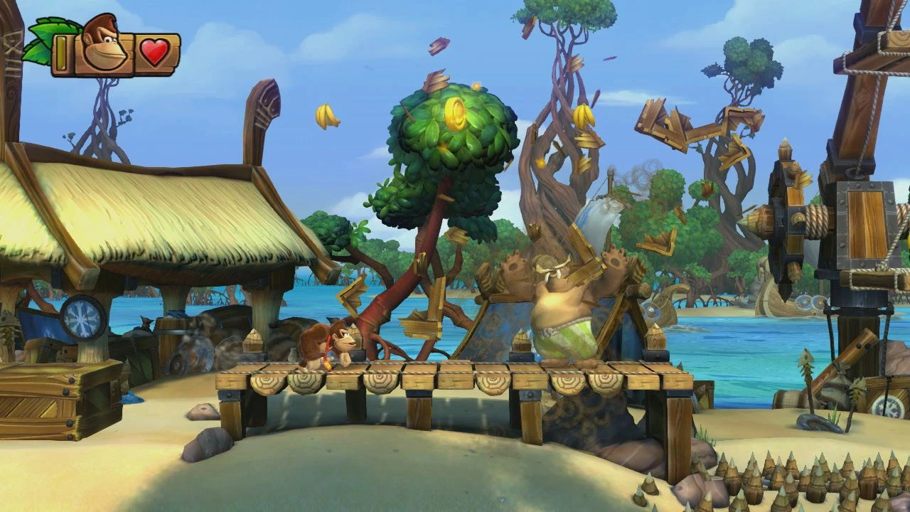 Donkey Kong crossing a platform above hazards in a bright Tropical Freeze village