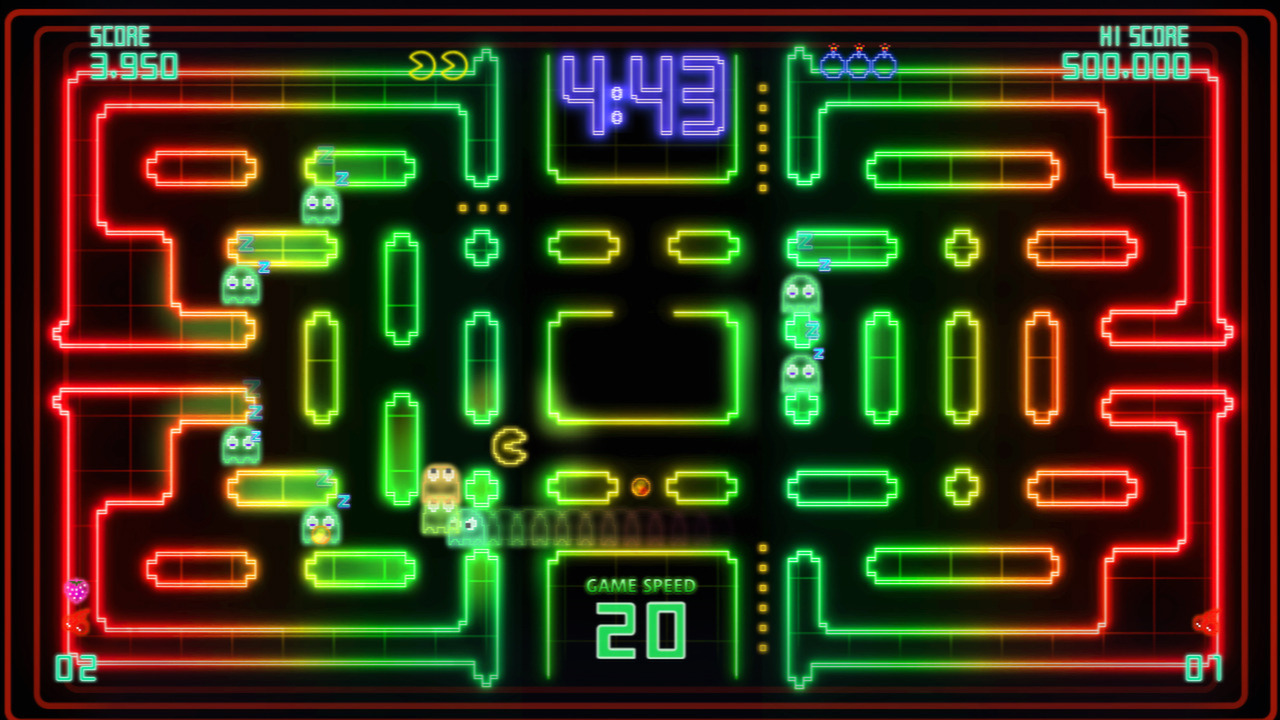 A neon PAC-MAN Championship Edition DX maze filled with a long train of pursuing ghosts