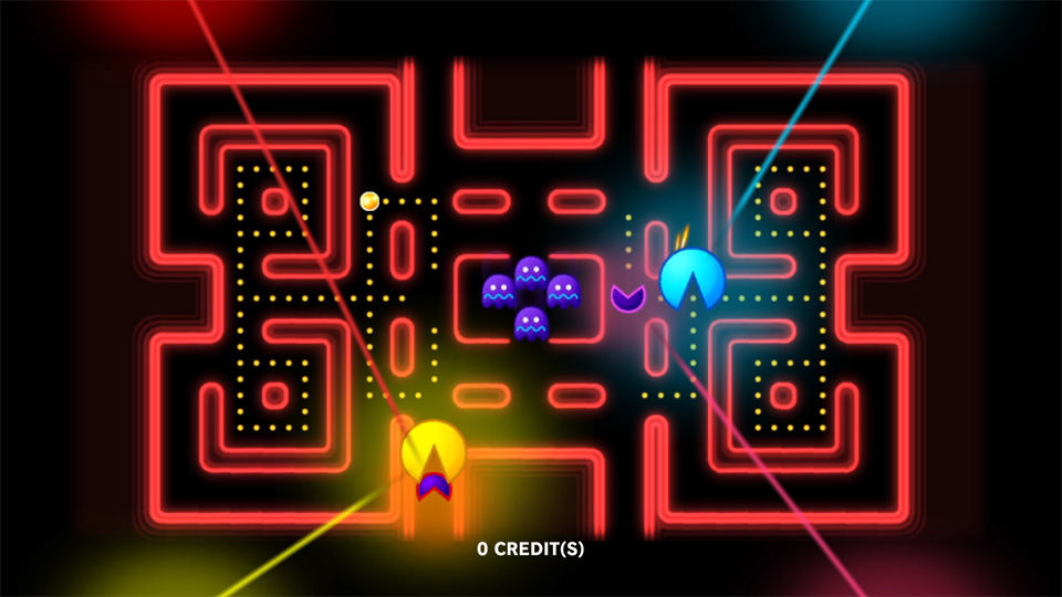 Four differently colored PAC-MAN characters competing in one maze