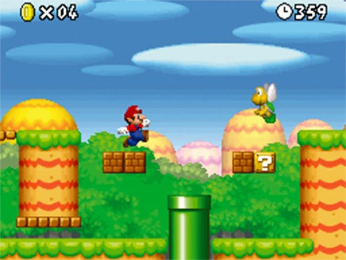 Mario jumping between brick platforms and a Koopa Troopa with the timer visible in New Super Mario Bros.
