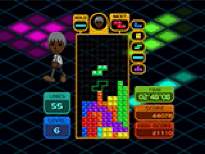 Players using Wii controllers and a Balance Board with Tetris Party