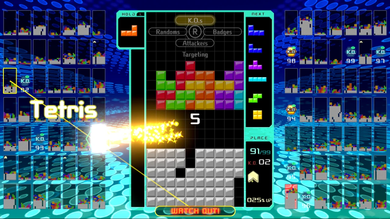 The central Tetris 99 matrix under attack, surrounded by live miniature playfields of the other 98 players