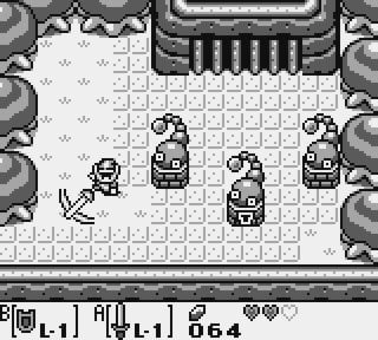 Link fighting armored enemies in a monochrome dungeon with hearts and equipped items visible in Link's Awakening.